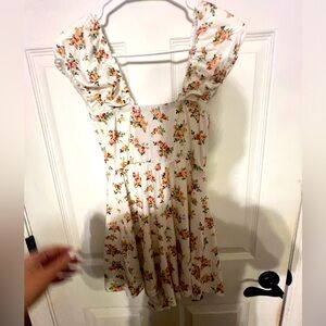 Very cute romper floral detail with a tie on the front brand www.lovetosite.com